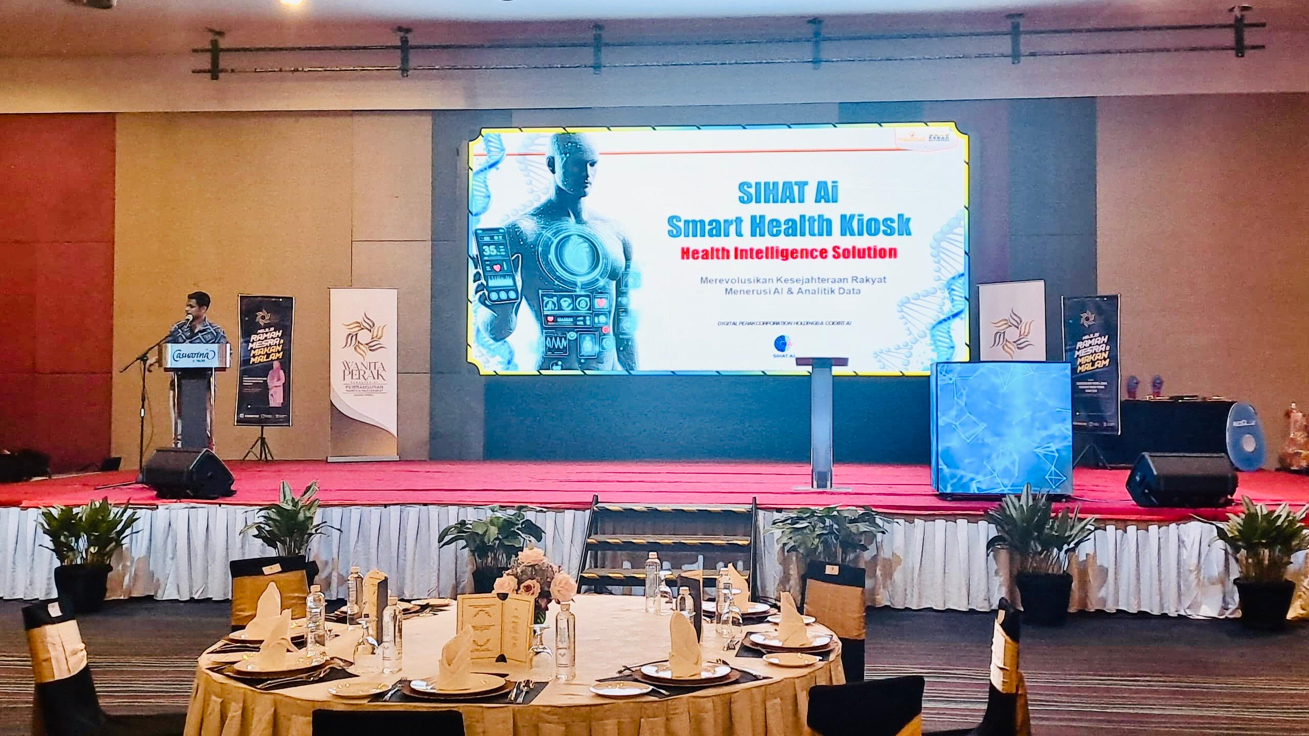 SIHAT AI Smart Health Kiosk presentation on stage at the "Golden Future" dinner for Sambutan Hari Warga Emas Peringkat Negeri Perak 2026