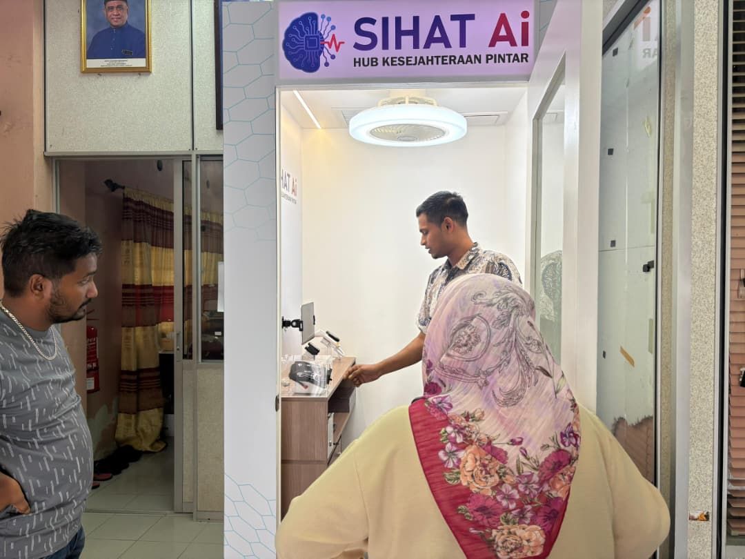 Visitors at the Sihat AI Smart Wellness Kiosk in Lenggong, Perak